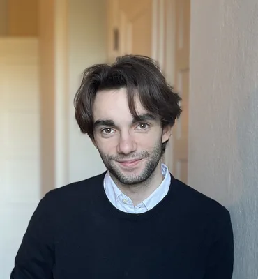 Portrait of Andrew Kaplan Cruz, CPO and CTO of The Qualidex